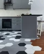 How to connect a wooden floor with stone or ceramic tiles?